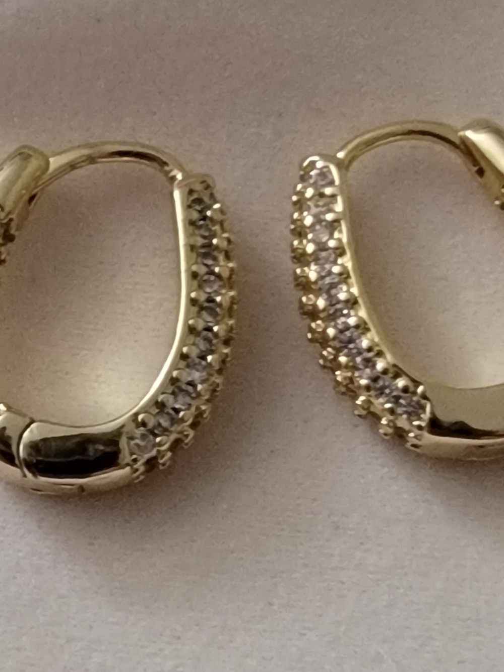 Gold Pavé Huggie Hoop Earrings with Clear Stones.
